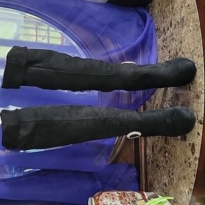 Woman's fashion high heel boots. Size 10. In gently used condition.